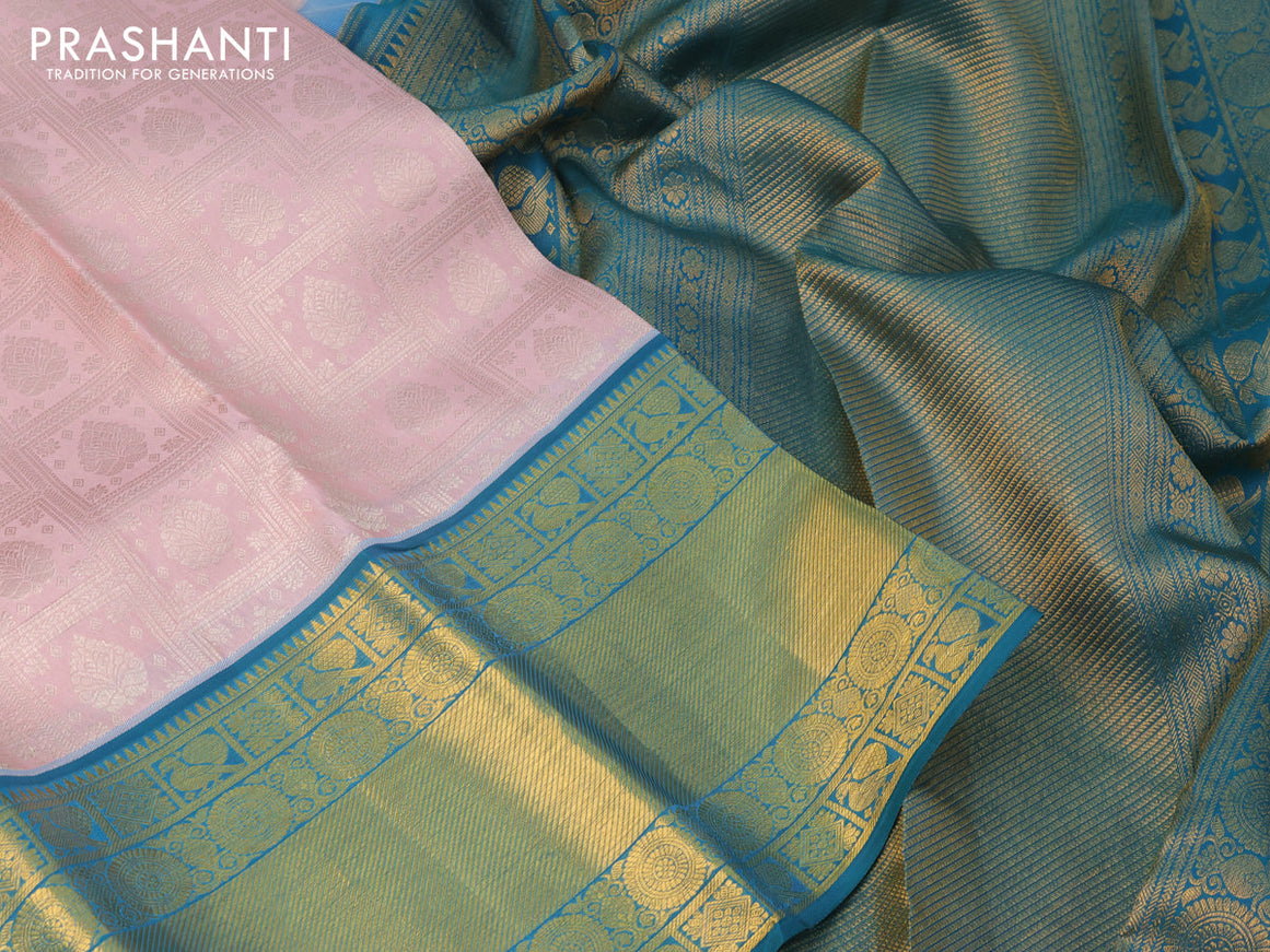 Pure kanchipuram silk saree pastel pink and peacock green with allover silver zari woven brocade weaves and long zari woven border