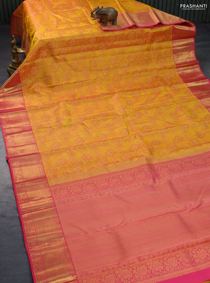 Pure kanchipuram silk saree mustard yellow and pink shade with allover zari woven floral design brocade weaves and zari woven border