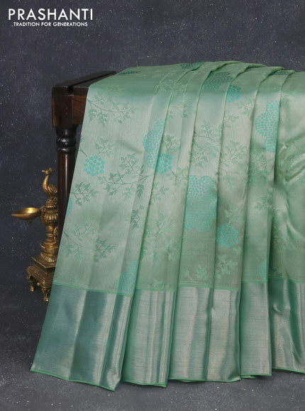 Pure kanchipuram tissue silk saree teal green with allover silver zari woven brocade weaves and silver zari woven border