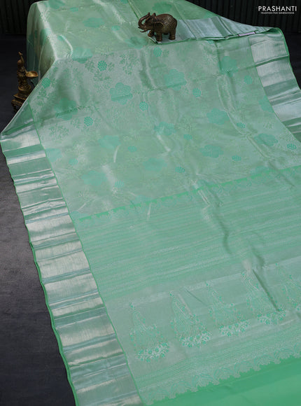 Pure kanchipuram tissue silk saree teal green with allover silver zari woven brocade weaves and silver zari woven border