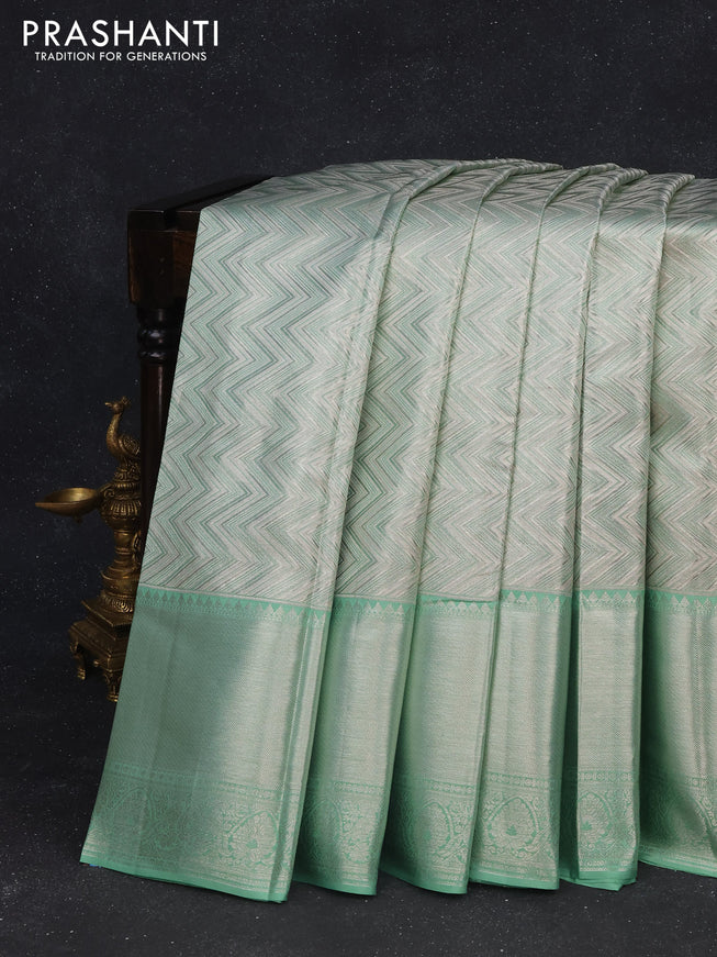 Pure kanchipuram tissue silk saree pastel green with allover silver zari woven brocade weaves and long silver zari woven border