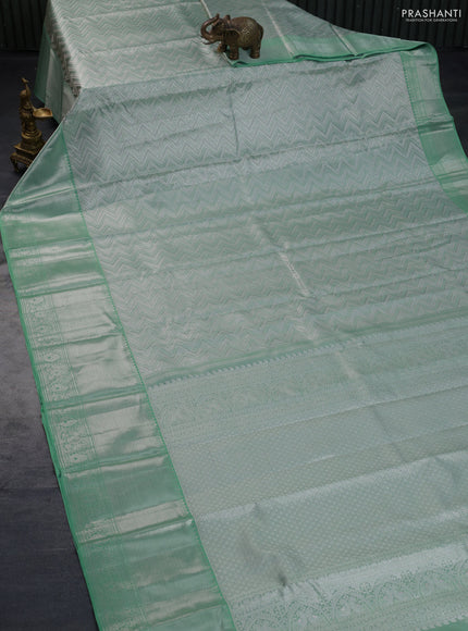 Pure kanchipuram tissue silk saree pastel green with allover silver zari woven brocade weaves and long silver zari woven border