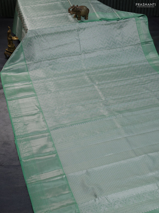 Pure kanchipuram tissue silk saree pastel green with allover silver zari woven brocade weaves and long silver zari woven border