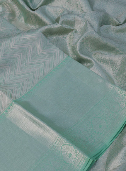 Pure kanchipuram tissue silk saree pastel green with allover silver zari woven brocade weaves and long silver zari woven border