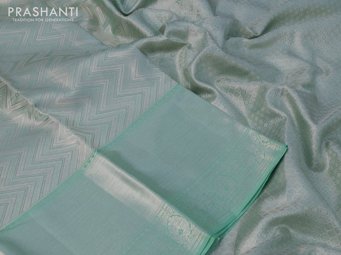 Pure kanchipuram tissue silk saree pastel green with allover silver zari woven brocade weaves and long silver zari woven border