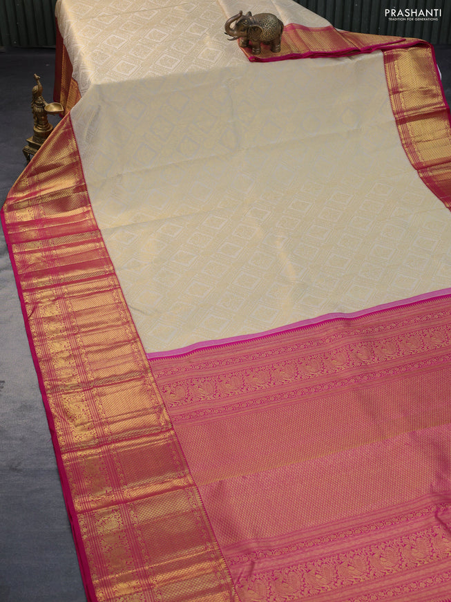 Pure kanchipuram silk saree cream and pink with allover zari woven brocade weaves and long zari woven border