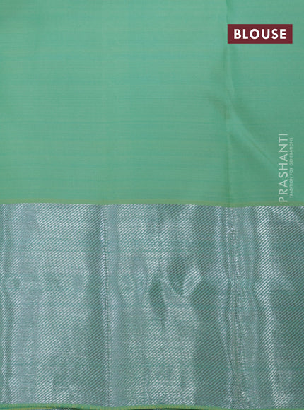 Pure kanchipuram silk saree pastel green with allover silver zari woven floral brocade weaves and silver zari woven border