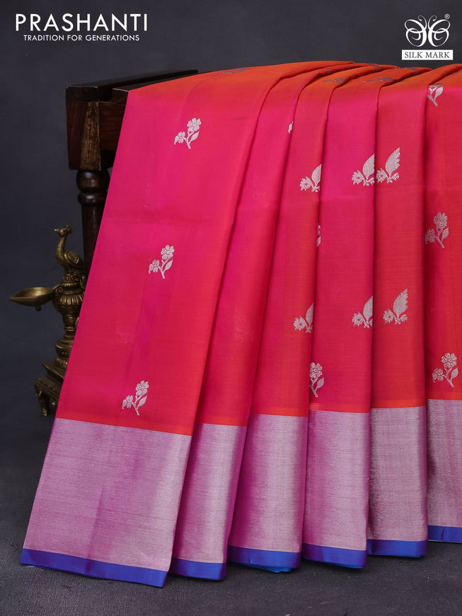 Venkatagiri silk saree dual shade of pinkish orange and cs blue with allover silver zari woven floral buttas and silver zari woven border