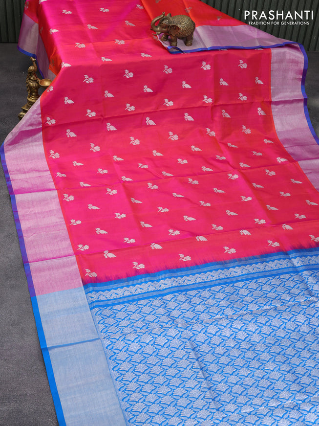 Venkatagiri silk saree dual shade of pinkish orange and cs blue with allover silver zari woven floral buttas and silver zari woven border