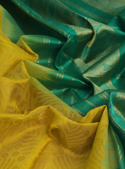 Silk cotton saree dark mustard yellow and green with allover self emboss jacquard and elephant zari woven border