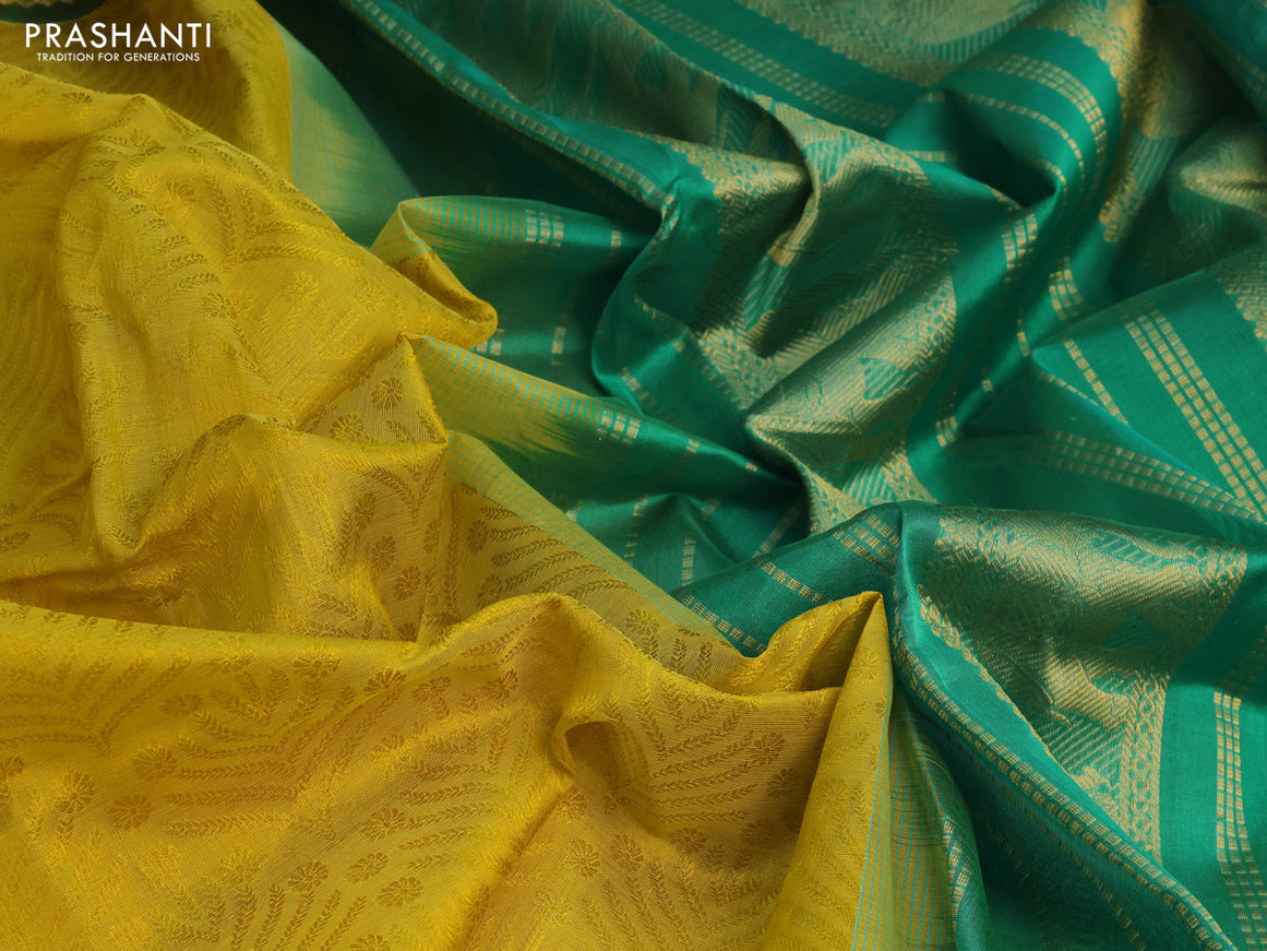 Silk cotton saree dark mustard yellow and green with allover self emboss jacquard and elephant zari woven border