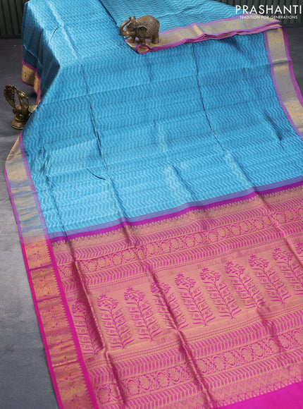 Silk cotton saree blue shade and magenta pink with allover self emboss jacquard and rich zari woven border