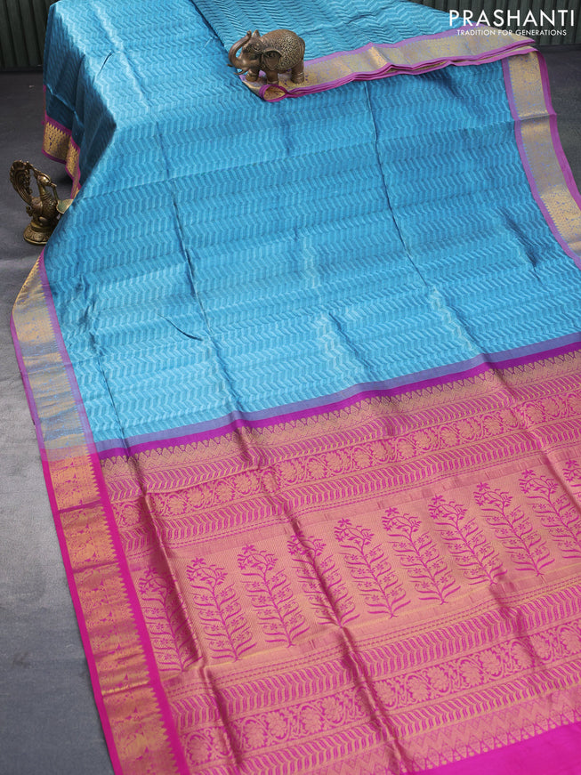 Silk cotton saree blue shade and magenta pink with allover self emboss jacquard and rich zari woven border