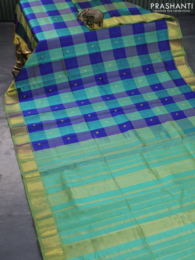 Silk cotton saree green shade and blue with allover paalum pazhamum checks & zari buttas and zari woven border