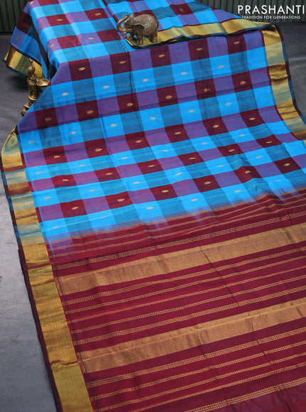 Silk cotton saree cs blue and deep maroon with allover paalum pazhamum checks & zari buttas and zari woven border