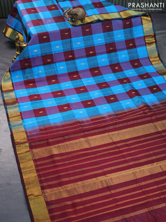 Silk cotton saree cs blue and deep maroon with allover paalum pazhamum checks & zari buttas and zari woven border