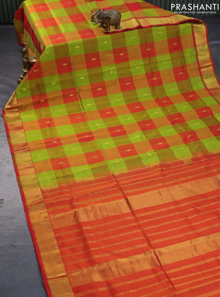 Silk cotton saree light green and orange with allover paalum pazhamum checks & zari buttas and zari woven border