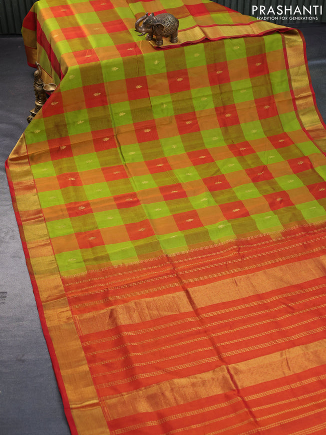 Silk cotton saree light green and orange with allover paalum pazhamum checks & zari buttas and zari woven border