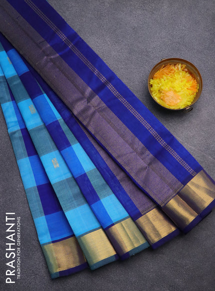 Silk cotton saree light blue and blue with allover paalum pazhamum checks & peacock zari buttas and zari woven border