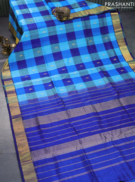 Silk cotton saree light blue and blue with allover paalum pazhamum checks & peacock zari buttas and zari woven border