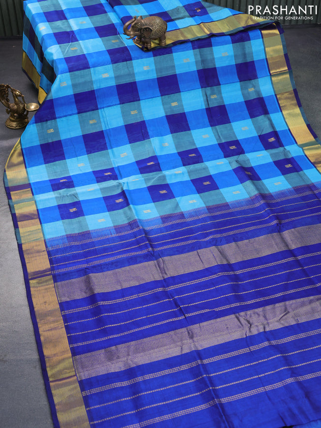 Silk cotton saree light blue and blue with allover paalum pazhamum checks & peacock zari buttas and zari woven border