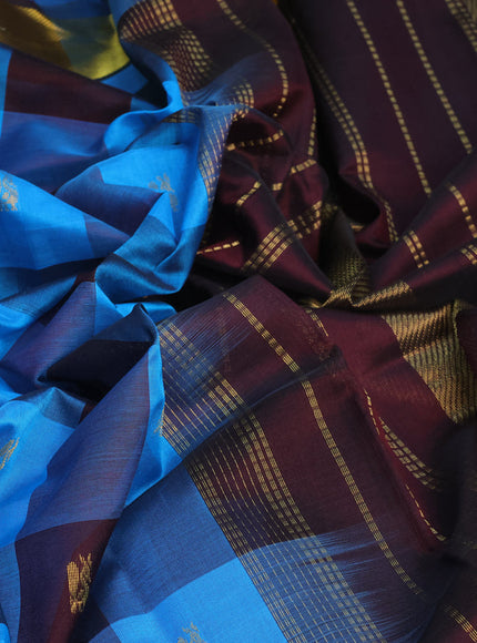 Silk cotton saree cs blue and coffee brown with allover paalum pazhamum checks & peacock zari buttas and zari woven border