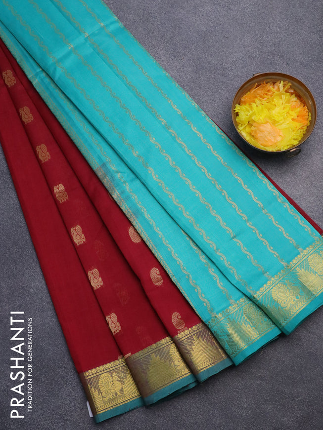 Silk cotton saree maroon and teal green with paisley & annam zari woven buttas and annam & temple design zari woven border