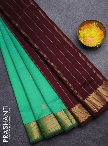 Silk cotton saree dual shade of teal greenish yellow and coffee brown with zari woven buttas and zari woven border