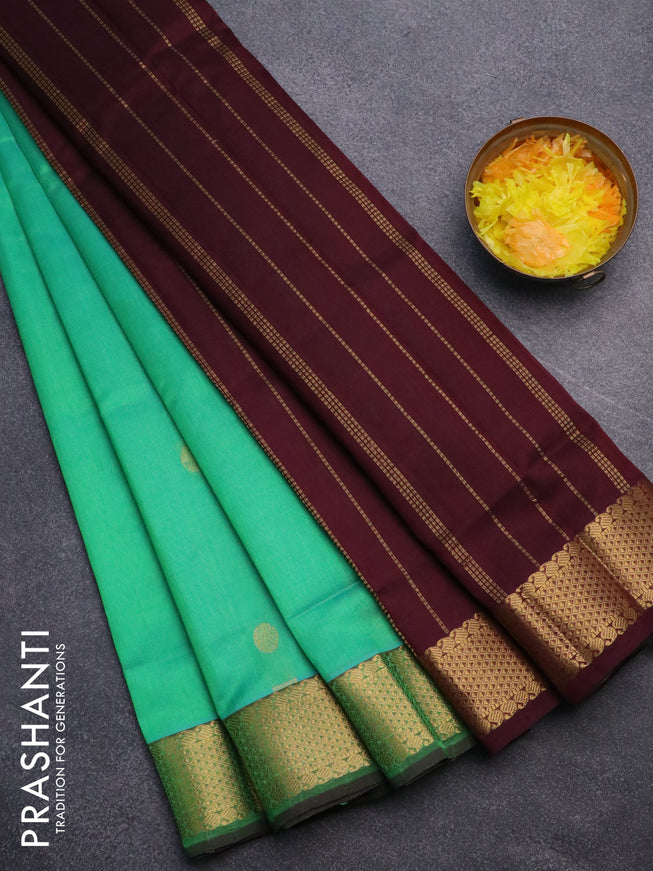 Silk cotton saree dual shade of teal greenish yellow and coffee brown with zari woven buttas and zari woven border