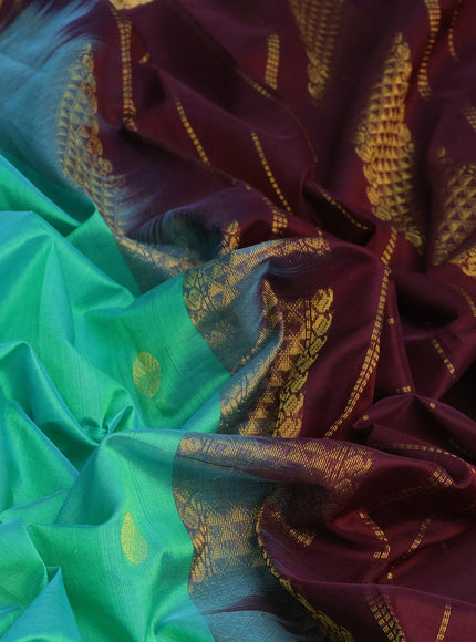 Silk cotton saree dual shade of teal greenish yellow and coffee brown with zari woven buttas and zari woven border