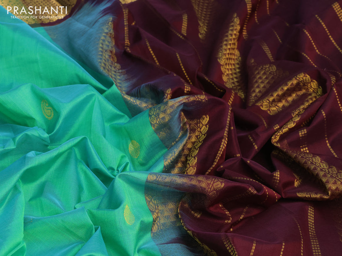 Silk cotton saree dual shade of teal greenish yellow and coffee brown with zari woven buttas and zari woven border