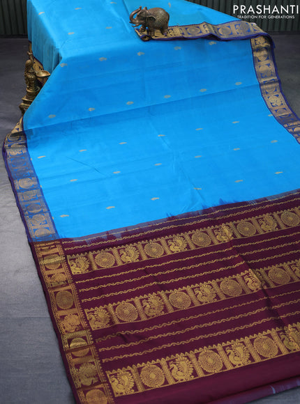 Silk cotton saree cs blue and wine shade with allover zari woven buttas and annam & rudhraksha zari woven border