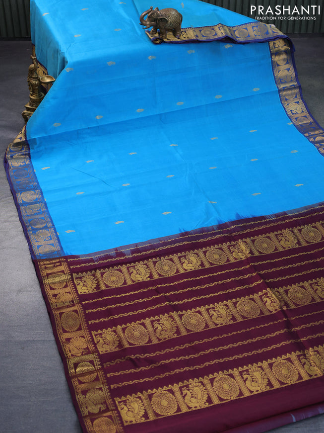 Silk cotton saree cs blue and wine shade with allover zari woven buttas and annam & rudhraksha zari woven border