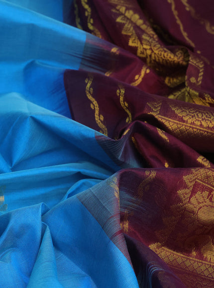 Silk cotton saree cs blue and wine shade with allover zari woven buttas and annam & rudhraksha zari woven border