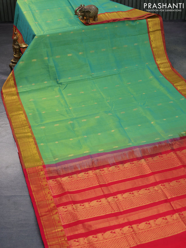 Silk cotton saree dual shade of greenish yellow and red with zari woven buttas and zari woven border