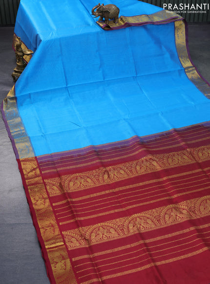 Silk cotton saree cs blue and maroon with allover vairosi pattern and peacock zari woven border