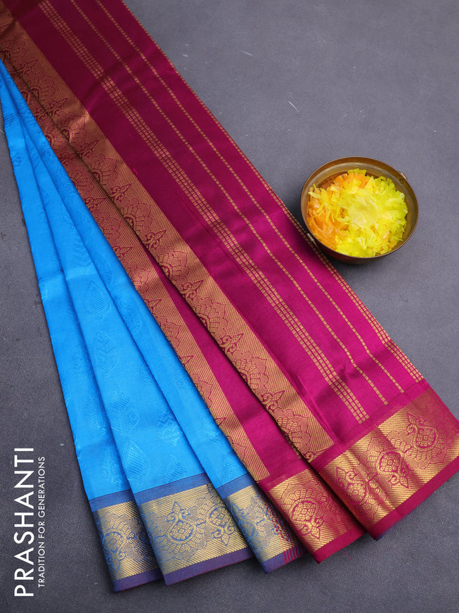 Silk cotton saree cs blue and purple with allover self emboss jacquard and zari woven border