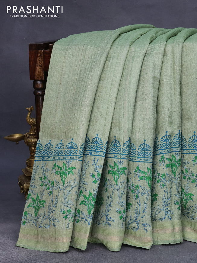 Banarasi tussar silk saree pastel green with plain body and printed pallu