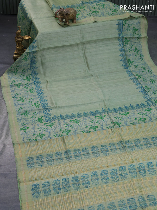 Banarasi tussar silk saree pastel green with plain body and printed pallu