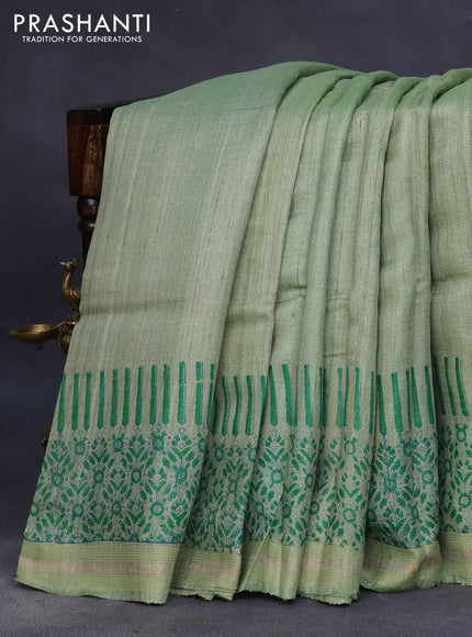 Banarasi tussar silk saree pastel green with plain body and printed pallu