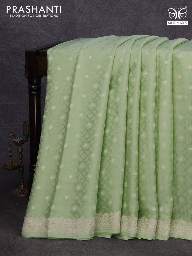 Pure banarasi crepe silk saree pista green with allover self emboss & zari buttas and zari woven border