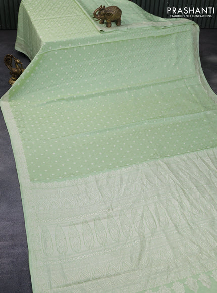 Pure banarasi crepe silk saree pista green with allover self emboss & zari buttas and zari woven border