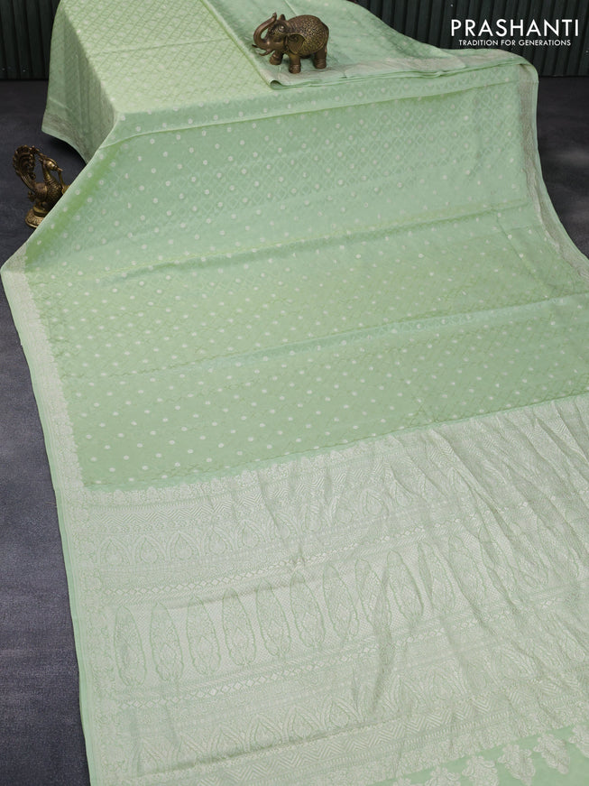 Pure banarasi crepe silk saree pista green with allover self emboss & zari buttas and zari woven border