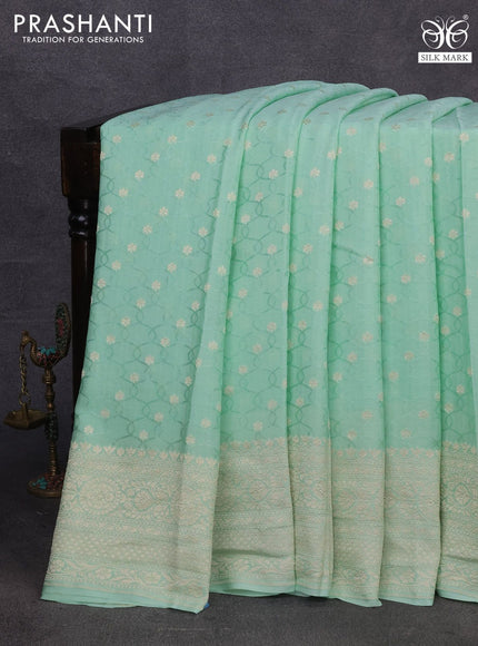 Pure banarasi crepe silk saree pastel green with allover self emboss & zari buttas and zari woven border