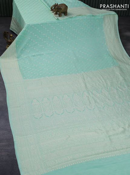 Pure banarasi crepe silk saree pastel green with allover self emboss & zari buttas and zari woven border