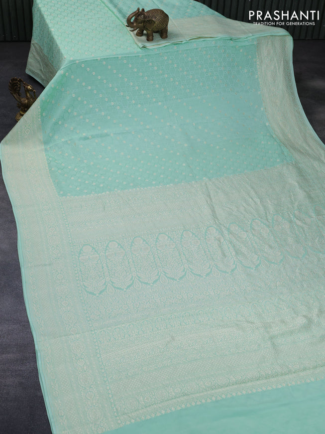 Pure banarasi crepe silk saree pastel green with allover self emboss & zari buttas and zari woven border