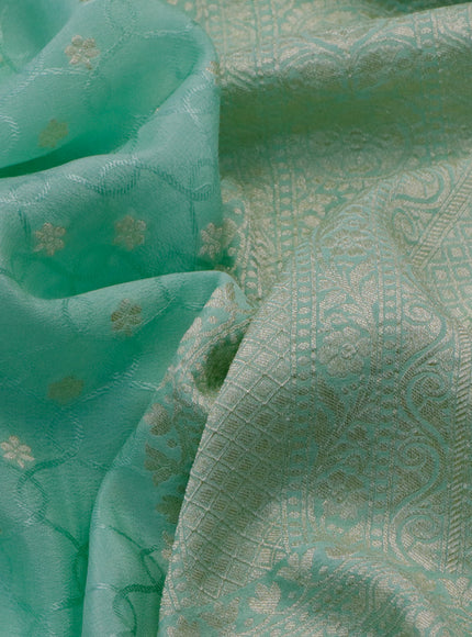 Pure banarasi crepe silk saree pastel green with allover self emboss & zari buttas and zari woven border