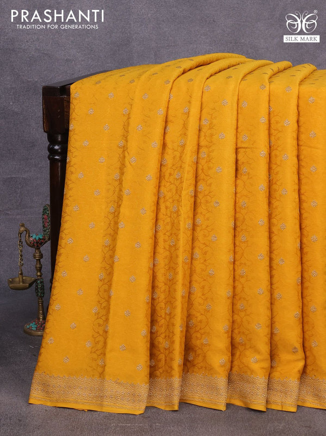 Pure banarasi crepe silk saree mustard yellow with allover self emboss & zari buttas and woven border