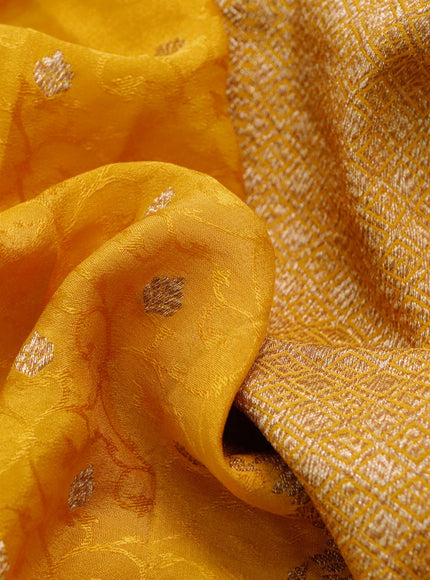 Pure banarasi crepe silk saree mustard yellow with allover self emboss & zari buttas and woven border