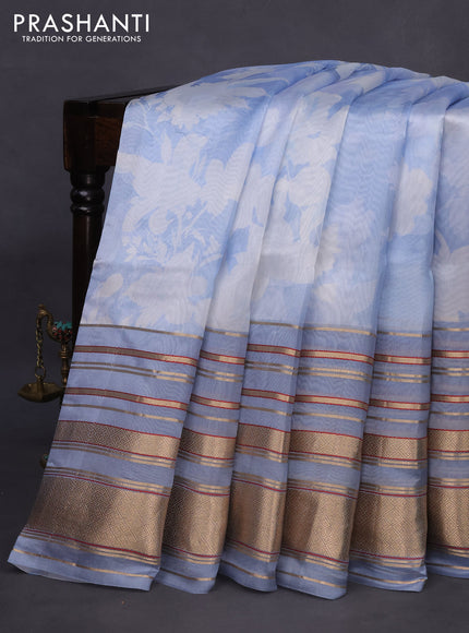 Pure dupion silk saree blue shade with allover floral prints and long zari woven border